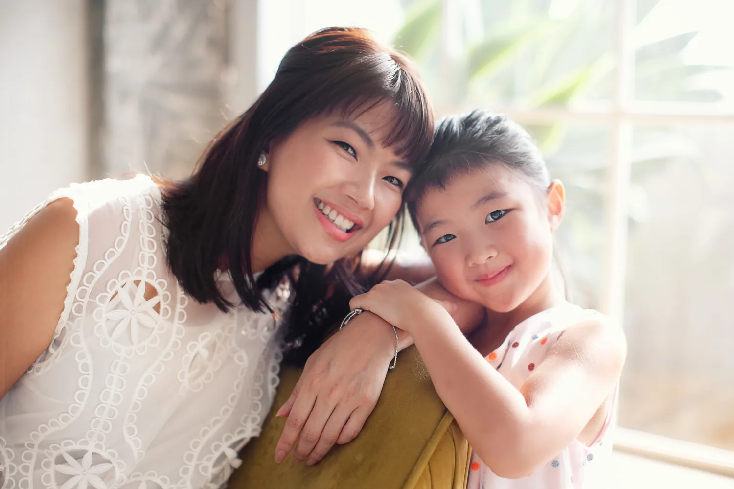 Mother and daughter portrait with soft natural light during a Singapore home shoot