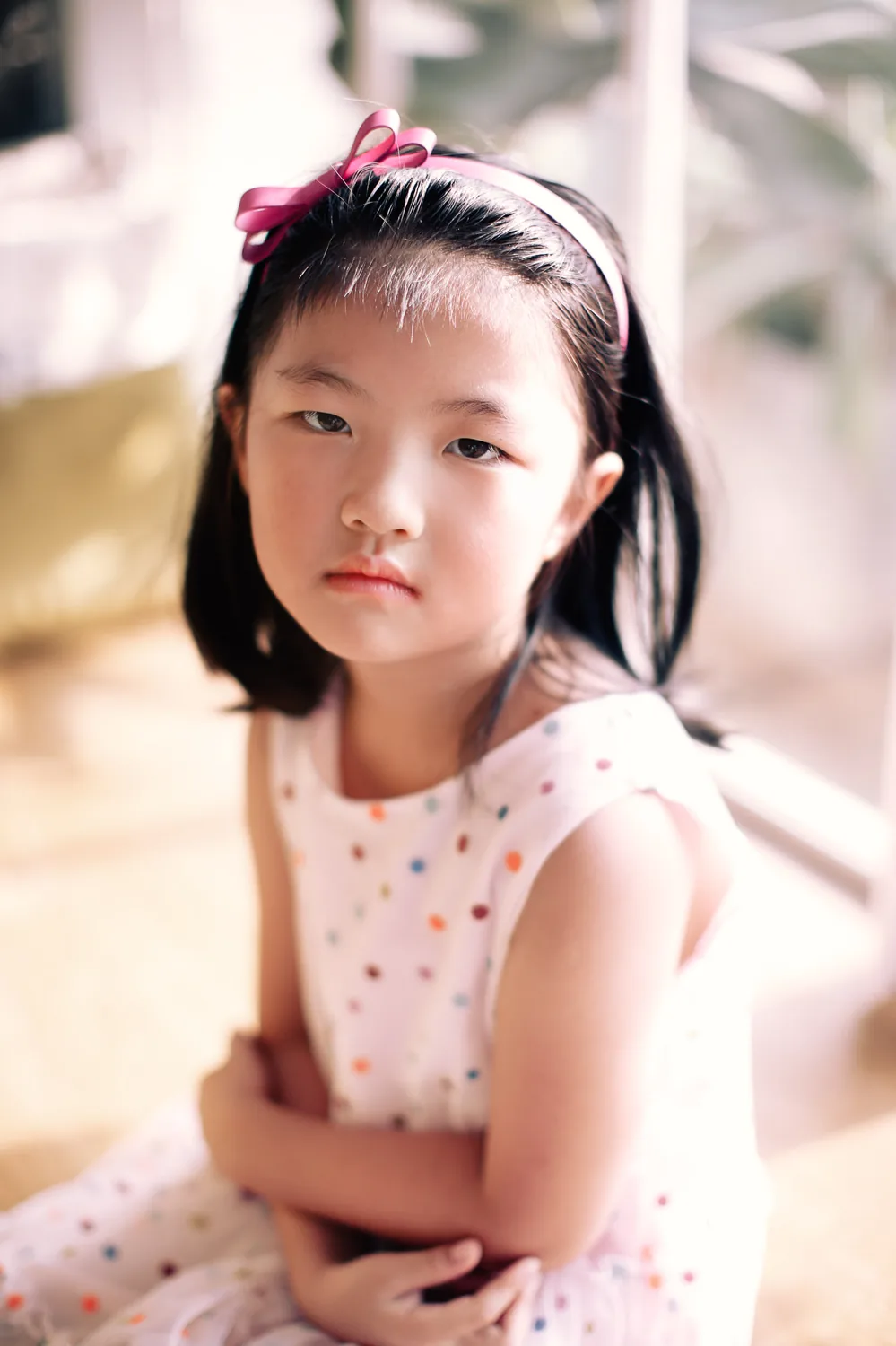 Angela with her daughters during a warm and candid family session at home