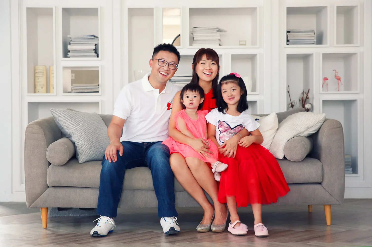 Indoor portrait of the two daughters during a Singapore home family session