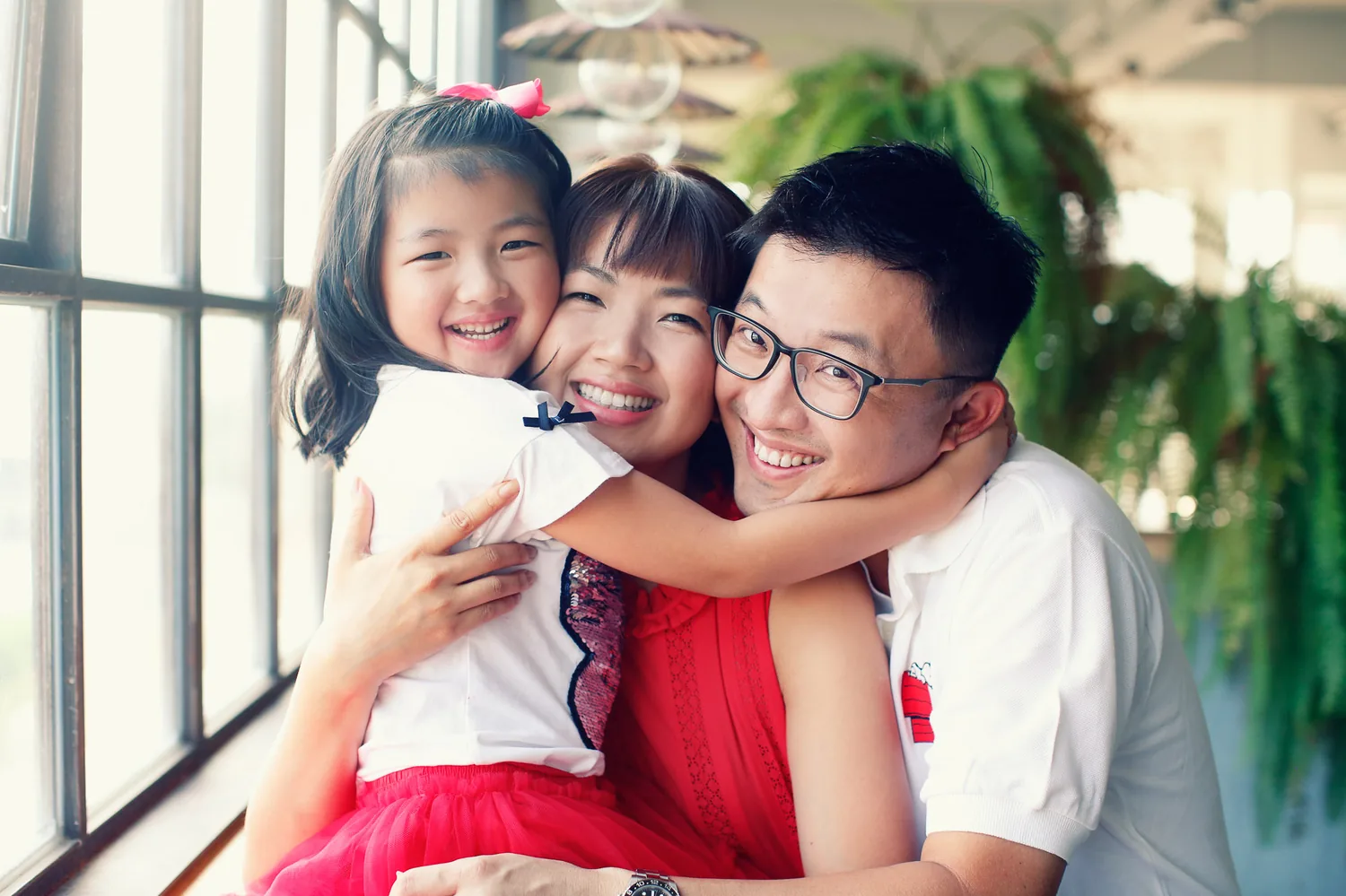 Angela, Andrew and their two daughters wrapping up their indoor family session in Singapore