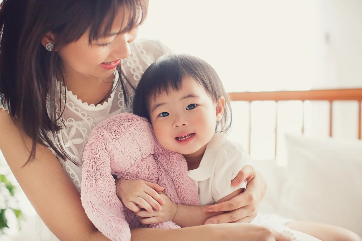 Mother and daughter moment during an indoor family photoshoot in Singapore