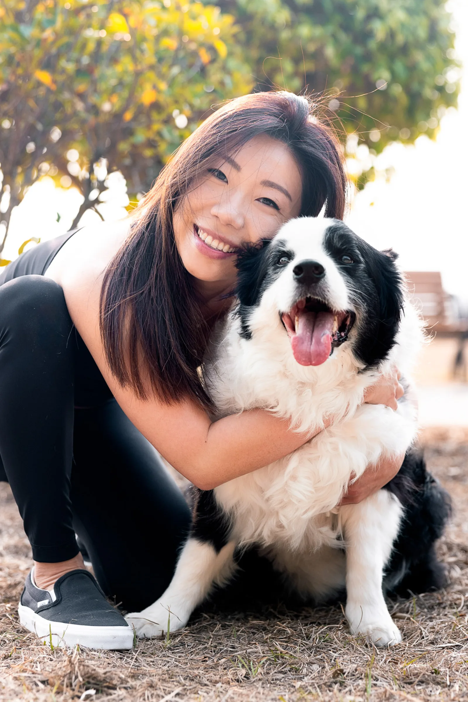 Ivy with border collie Obi on the beach during early morning couples shoot
