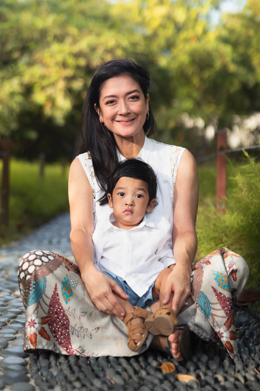 The twin boys together in matching outfits at Singapore Botanic Gardens