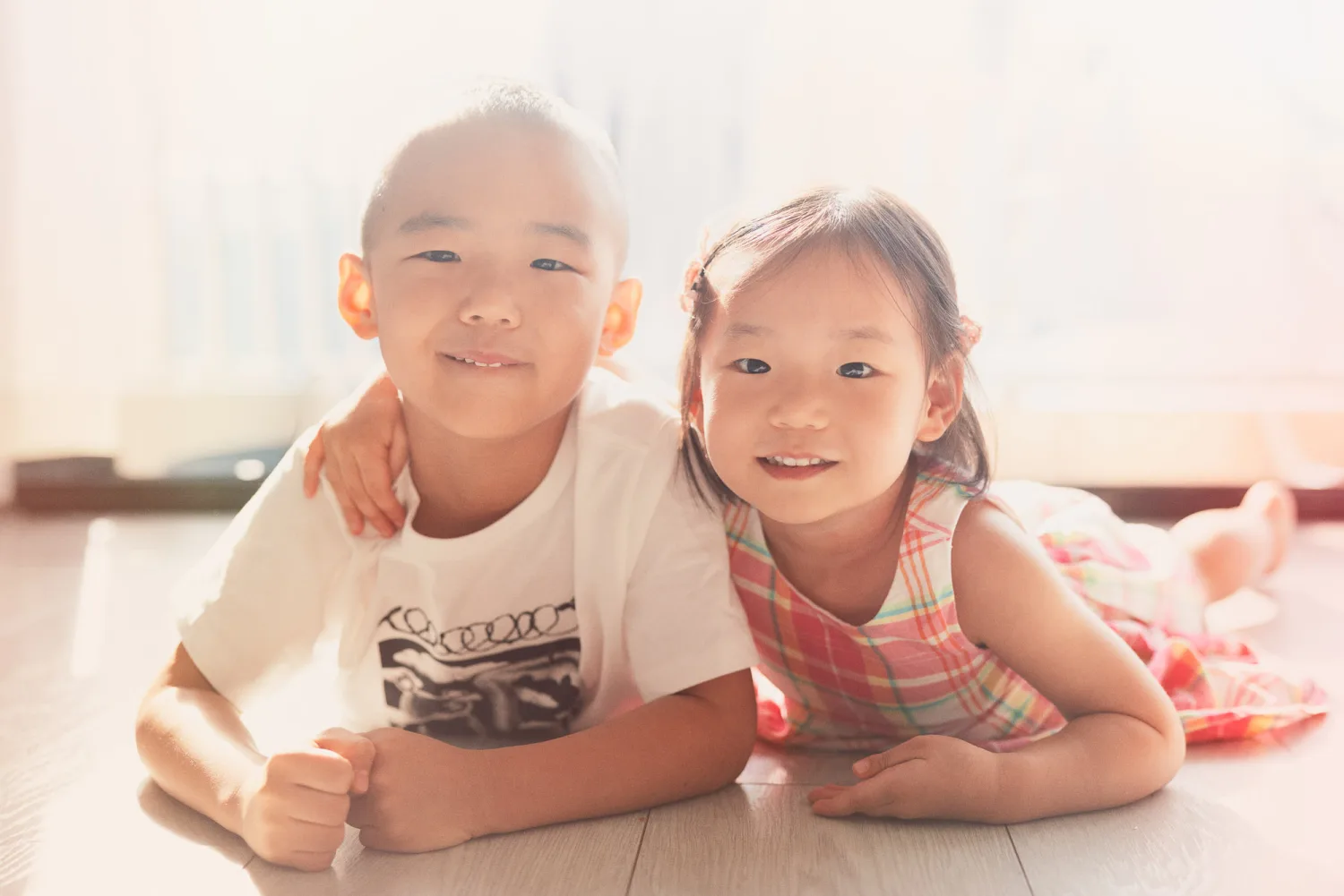 Nathan and Amelia sharing a quiet indoor sibling moment