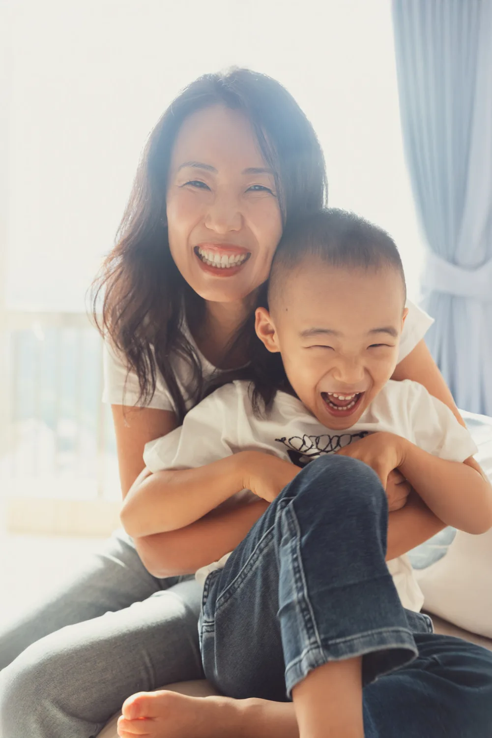 Chelsea laughing with Nathan during the indoor family session