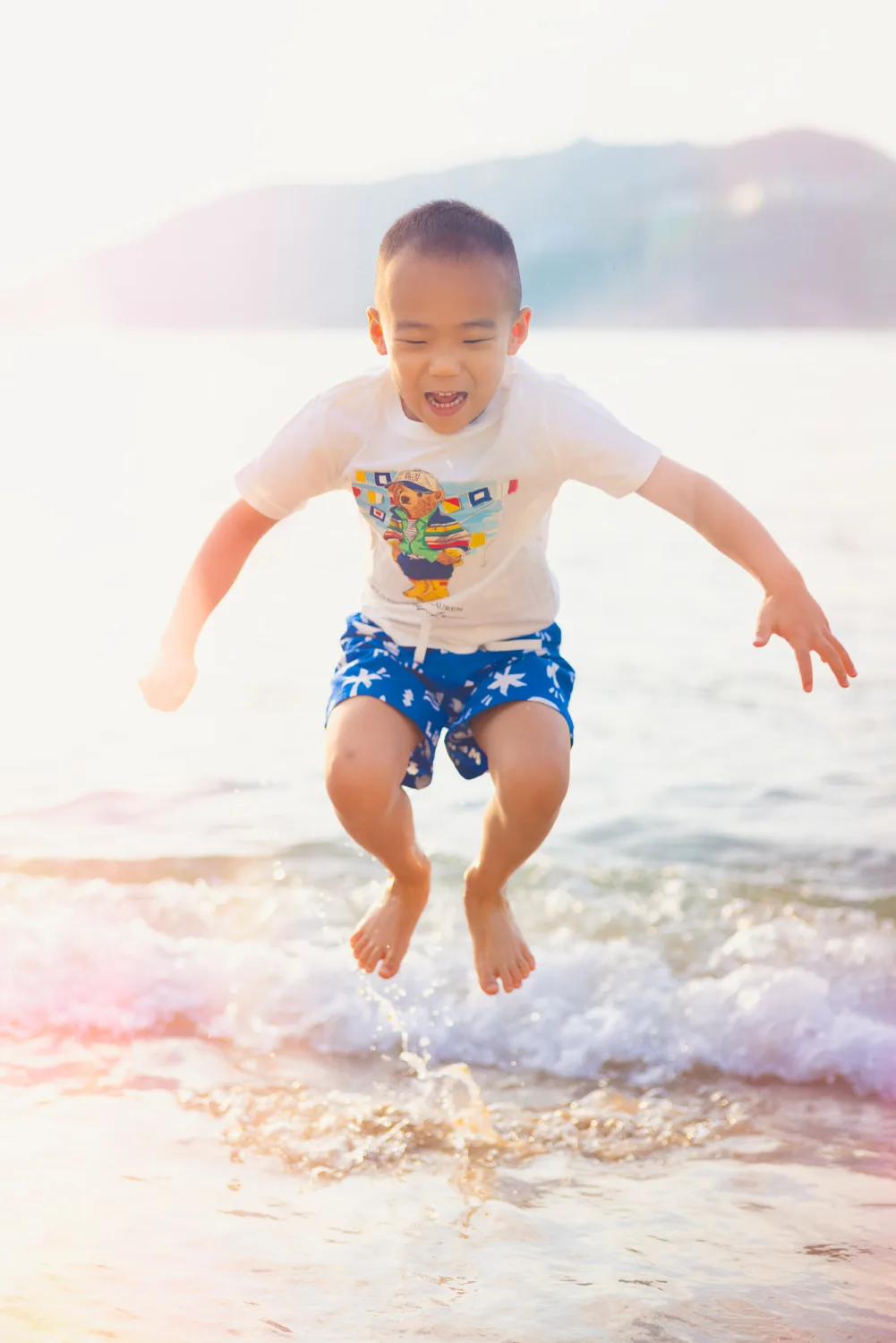 Nathan jumping out of the water during the beach session