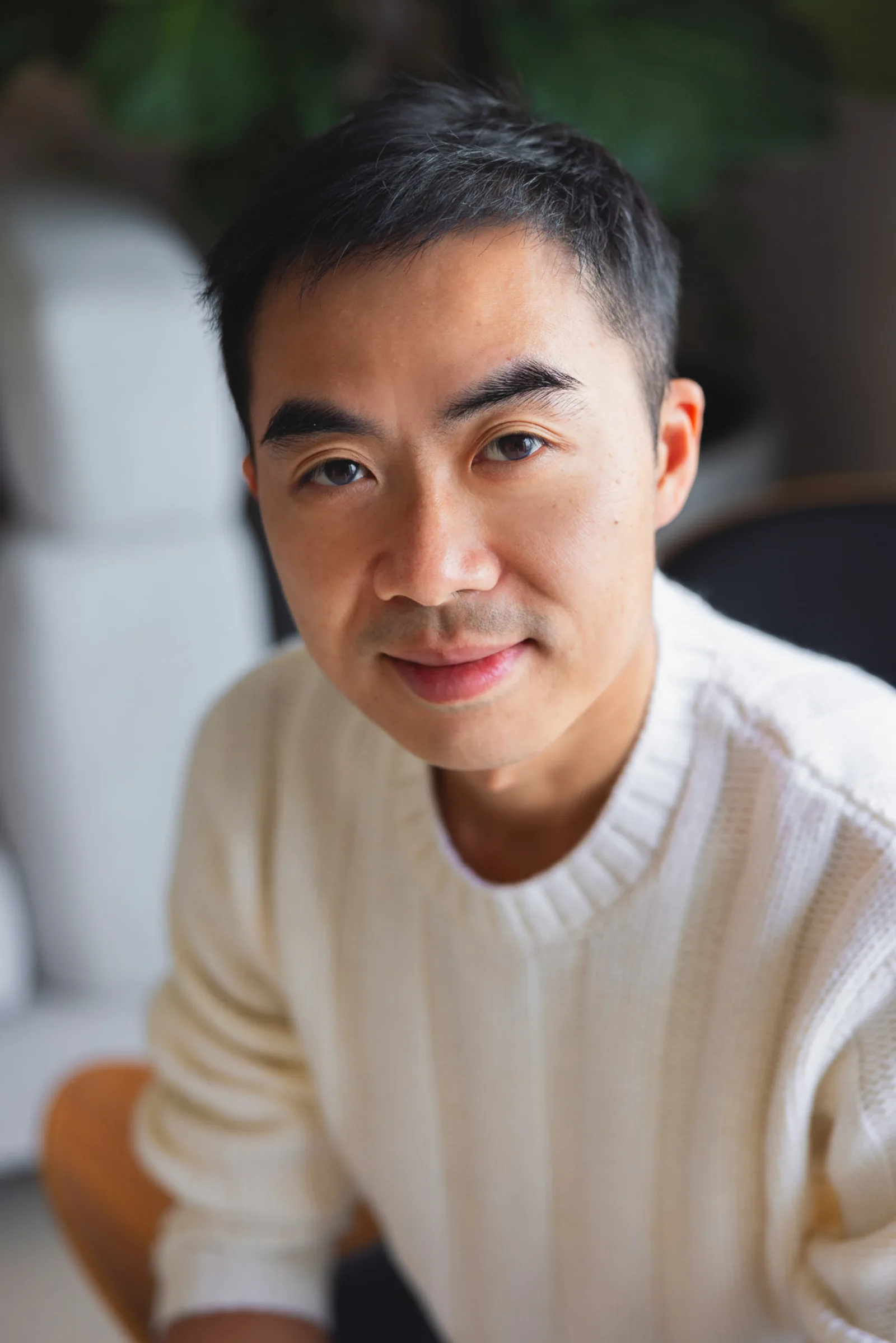 Sisters holding hands during indoor family photoshoot in Singapore