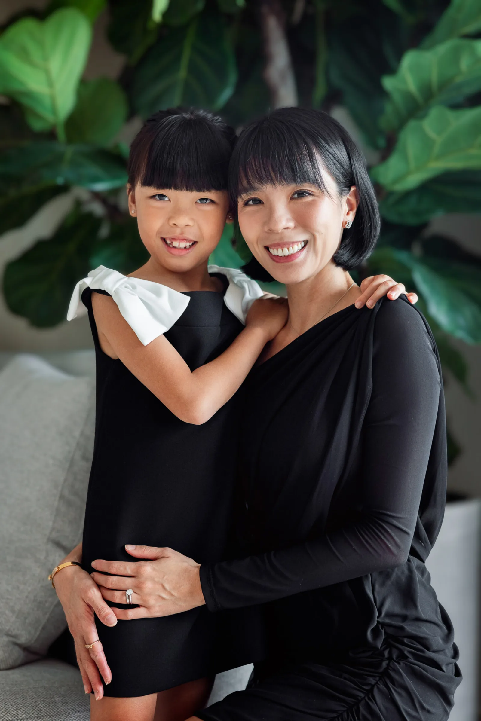 Two sisters in matching outfits during Singapore family photoshoot