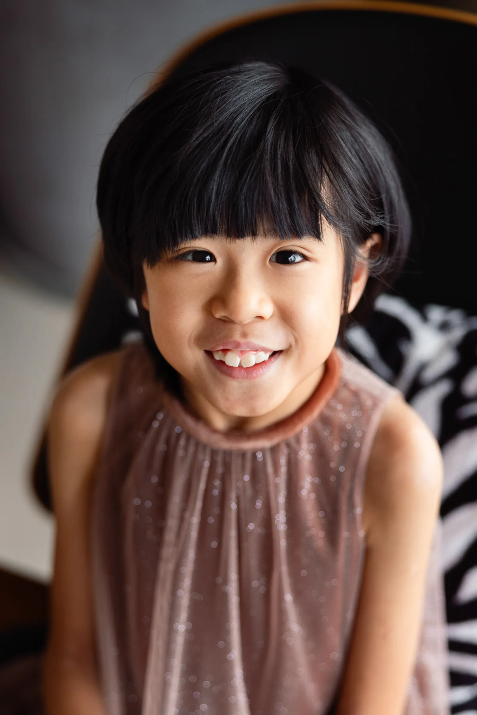 Mother and daughters sharing a moment during dressy indoor shoot