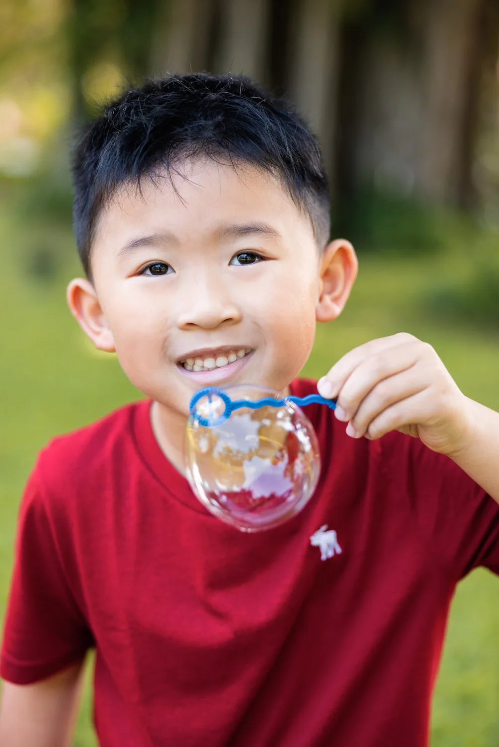 A close-up portrait of Tristan during the Fort Canning family session