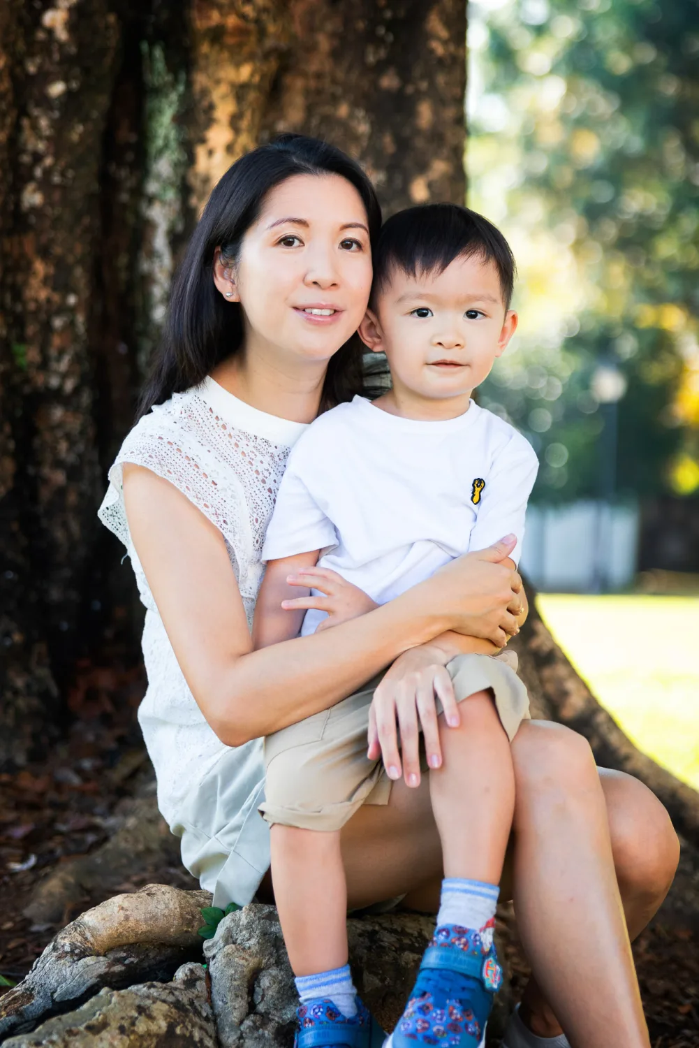 The family together at Fort Canning with the boys tucked in between their parents