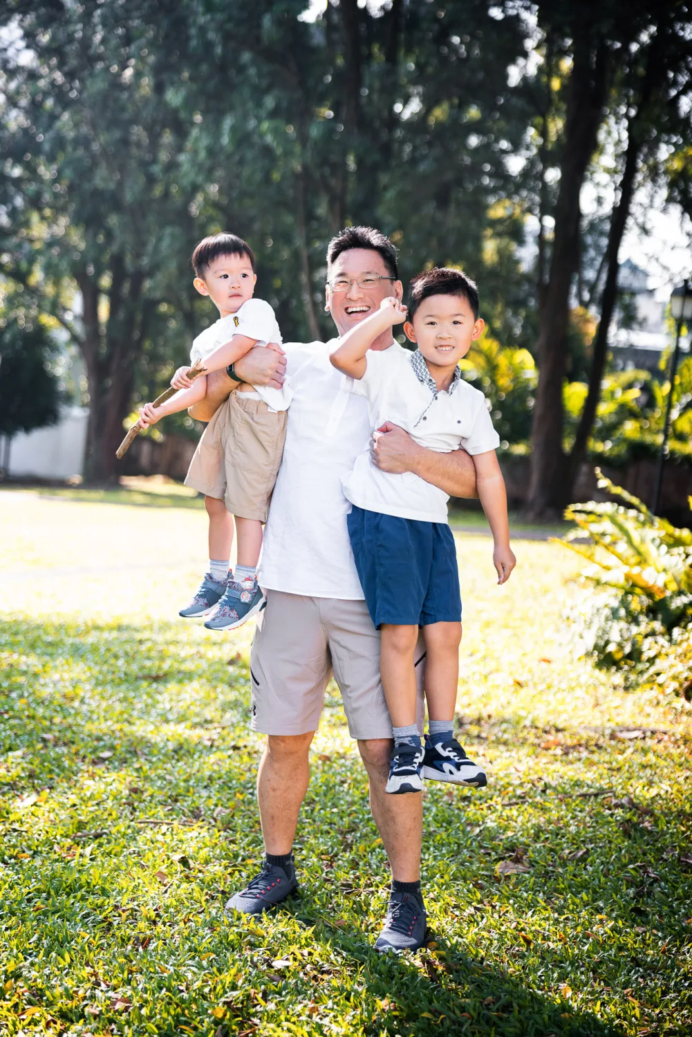 Kevin with the boys in a playful Fort Canning moment under the trees