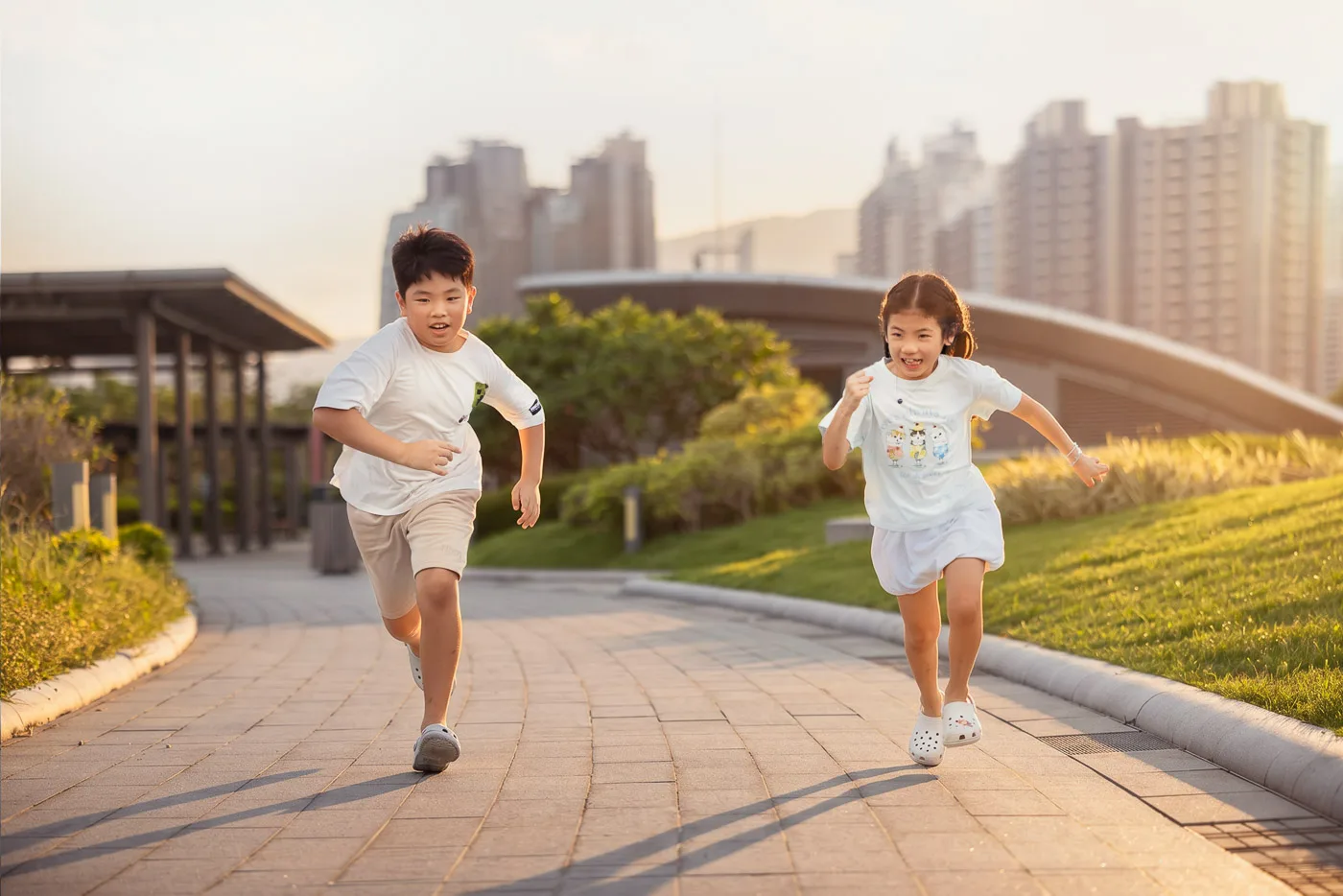 Four children walking together during a family friends photoshoot by the Hong Kong waterfront