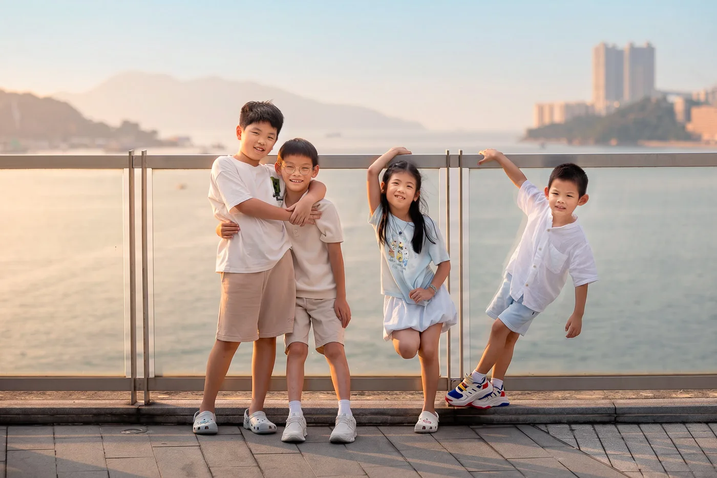 Family friends gathered for portraits during a Hong Kong waterfront photoshoot