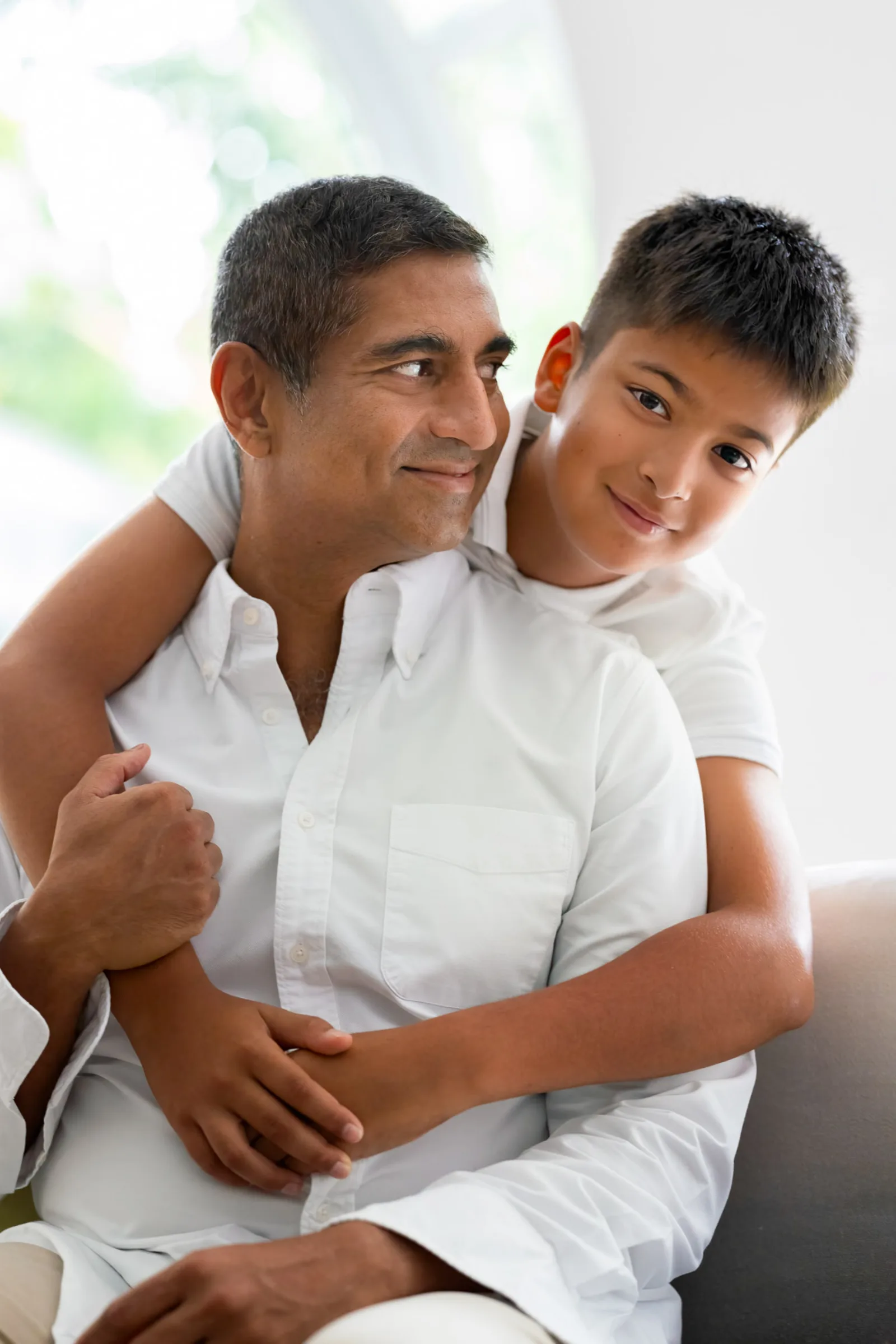 Singapore family photographer captures father and daughter sharing a quiet moment indoors