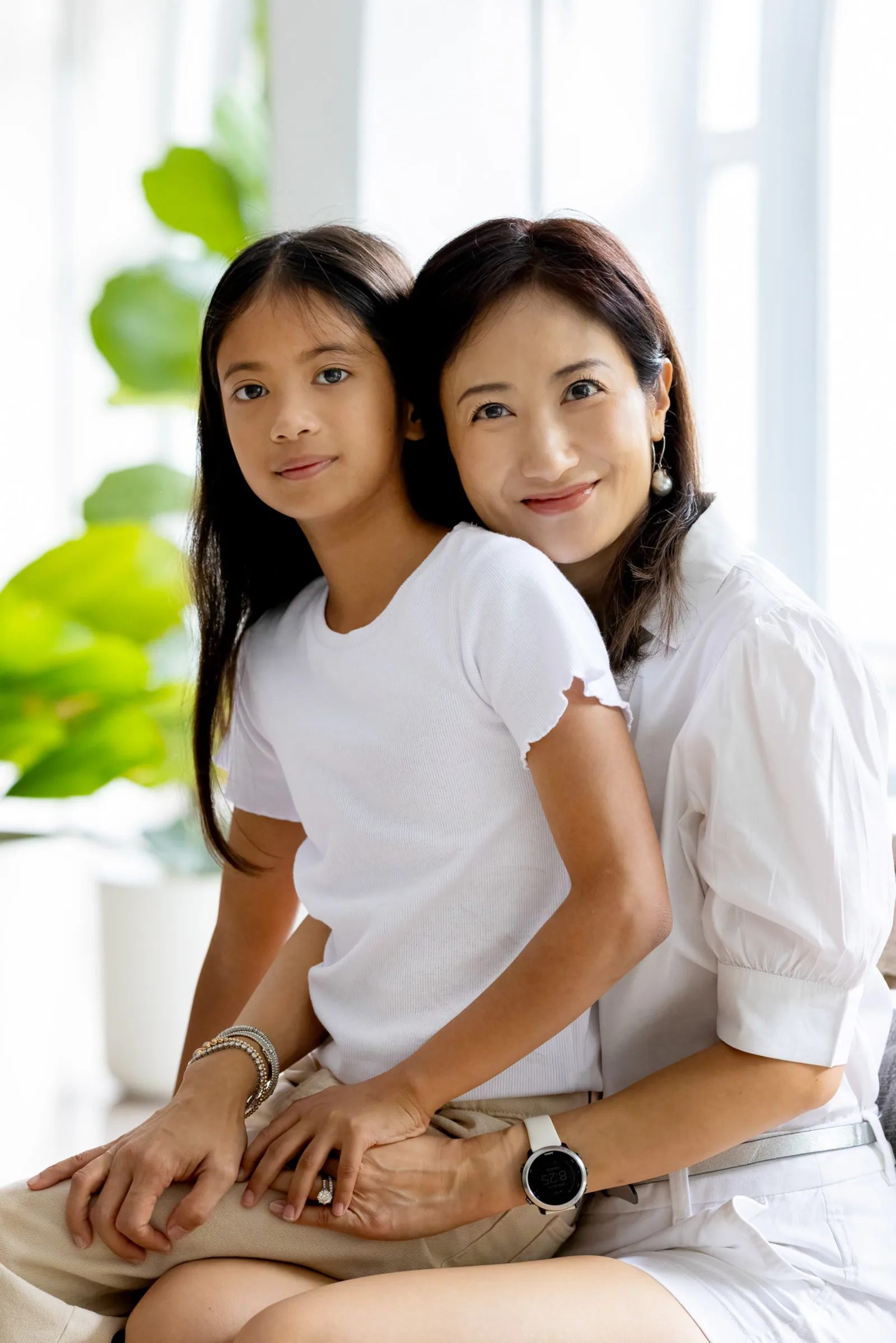 Singapore indoor family session capturing candid laughter between siblings