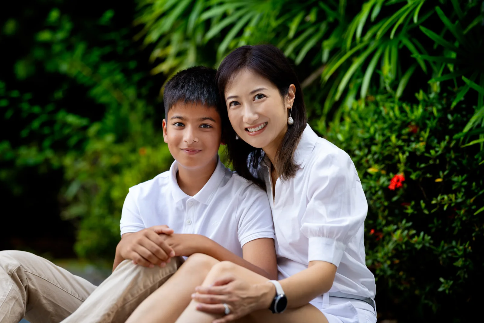 Parents sharing a genuine laugh during their Singapore home photography session