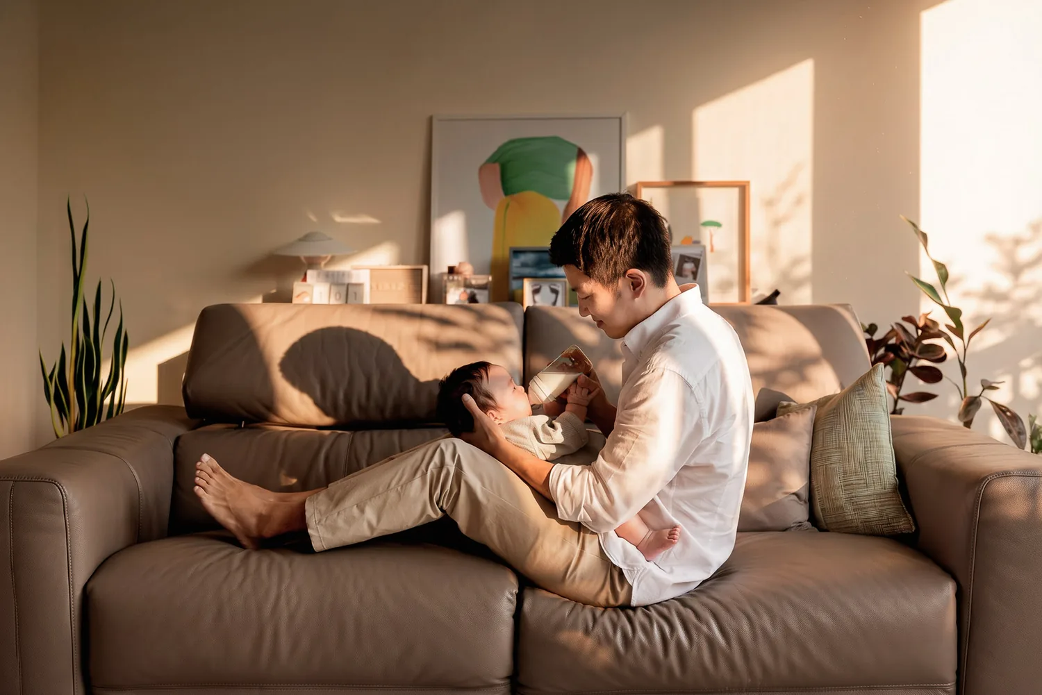Ji cuddling Juwon on the sofa at home during the 100-day celebration