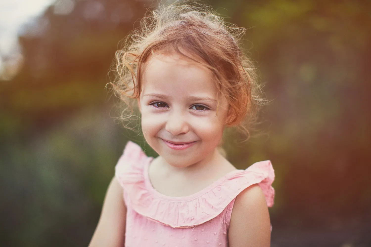 Laurence and Alex family session with the girls exploring the rock clearing