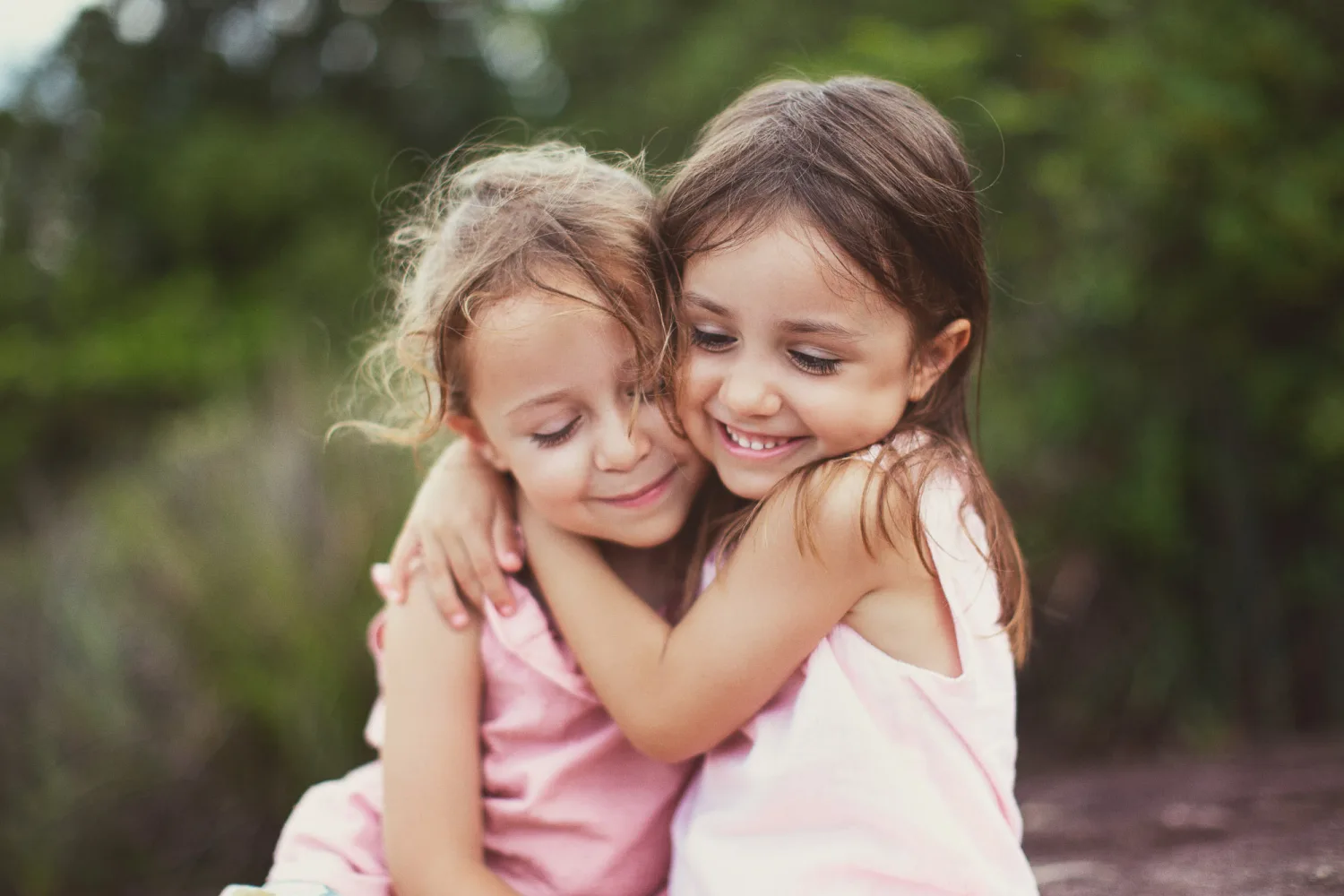 A portrait of Alex and the girls during the secret-location family session in Hong Kong