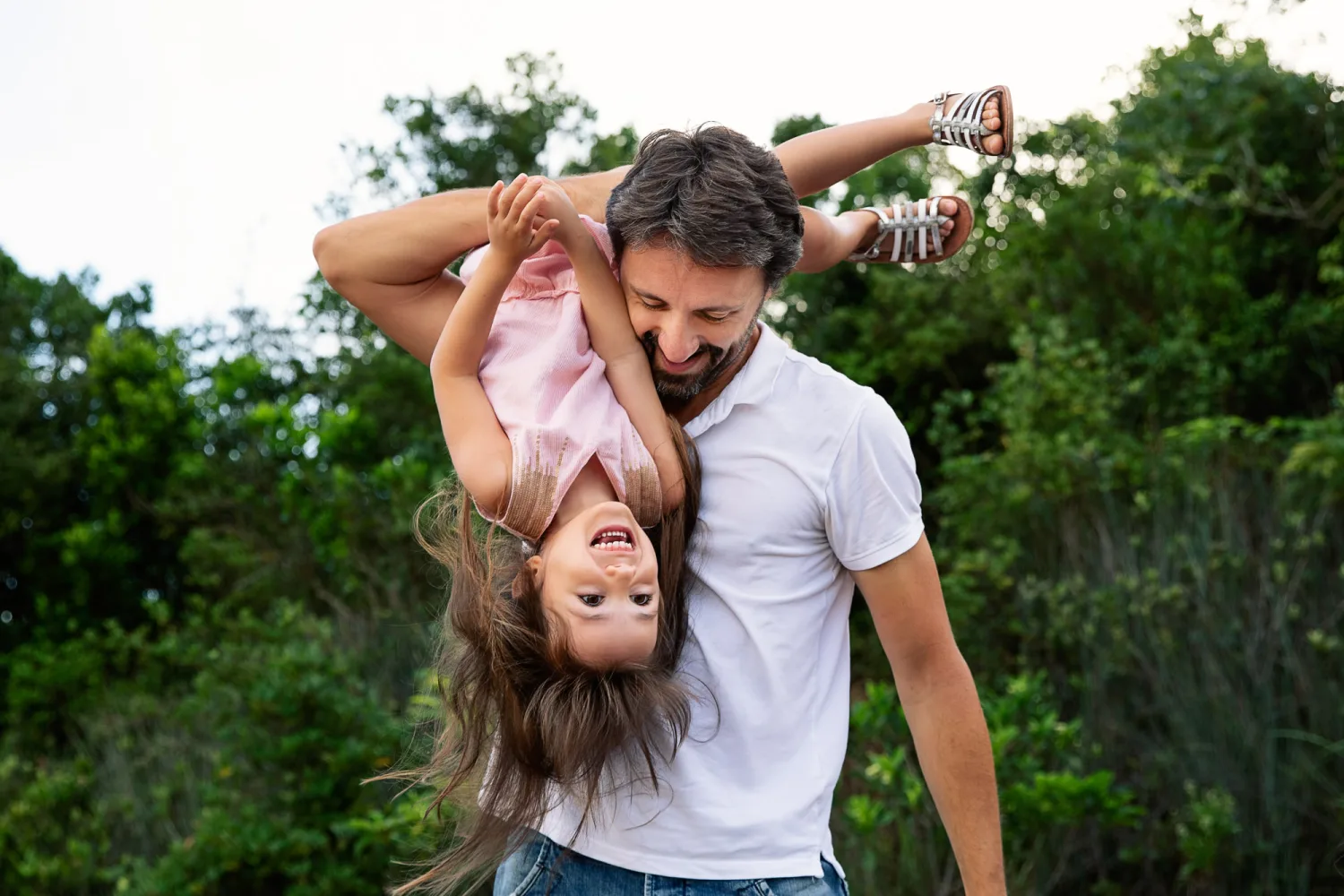 The family arriving at the rock slab clearing with a hidden Hong Kong view behind them