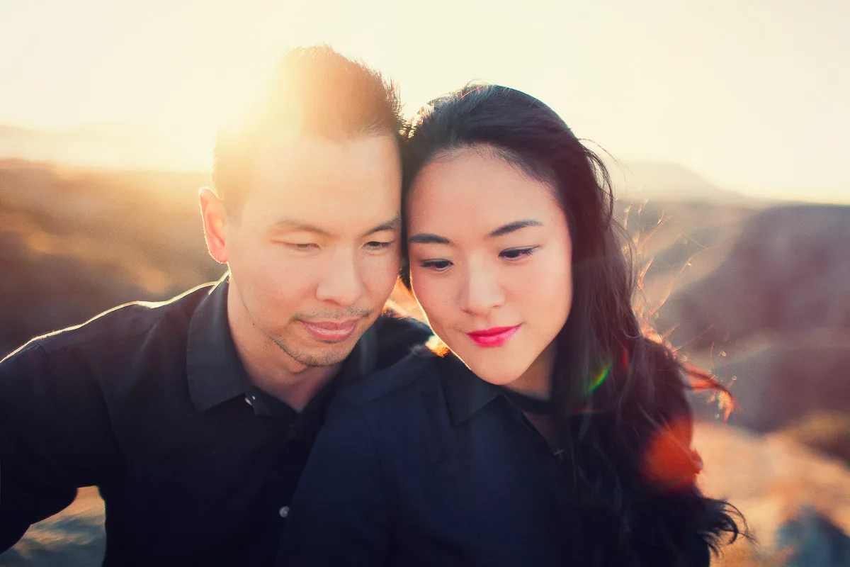 Julie and James walking through Joshua Tree during their engagement session