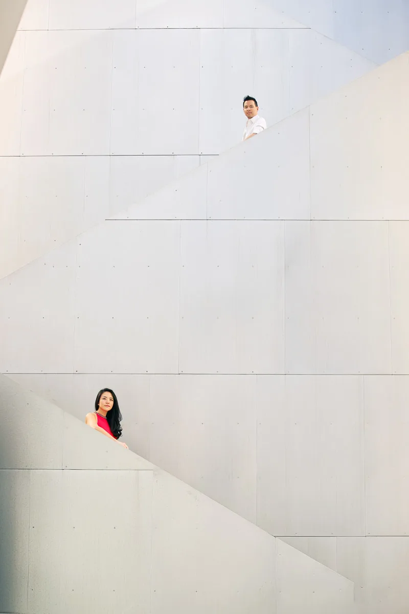 Julie and James framed by large geometric shapes during their Los Angeles engagement session