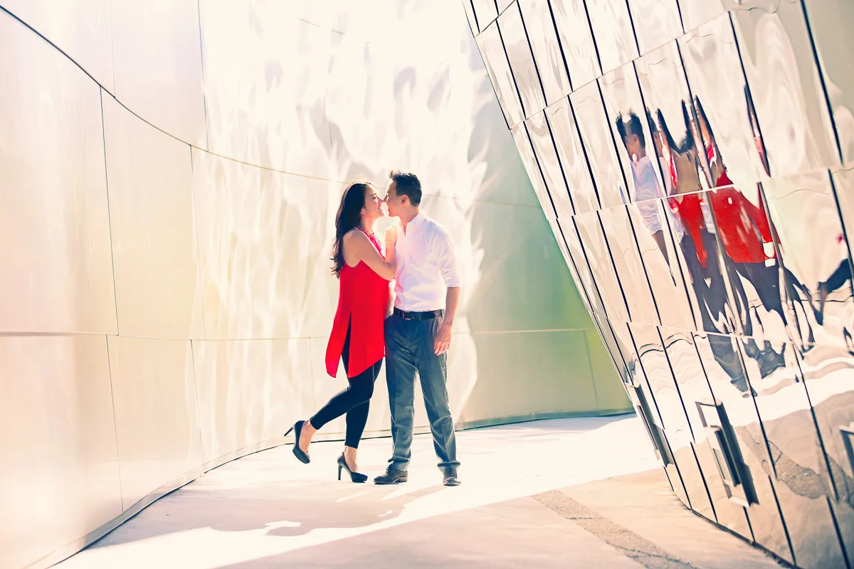 Julie and James reflected in metallic panels during their Los Angeles engagement session