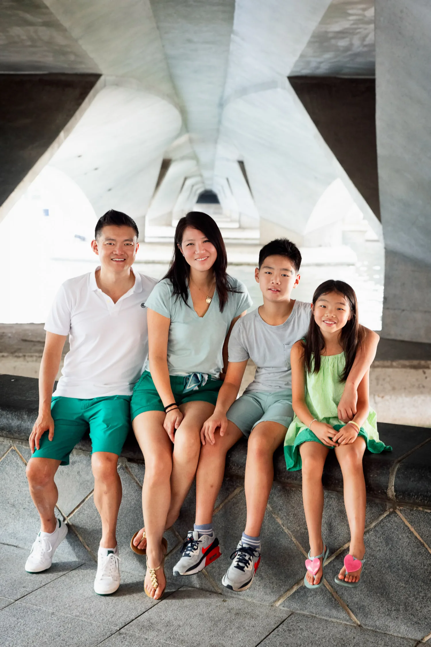 Casey, Sharon, Avery, and Mirei seated together in a modern Singapore architectural space