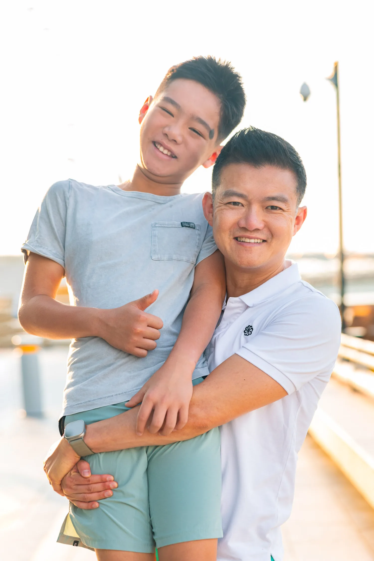 Casey and Avery smiling together with a playful thumbs up