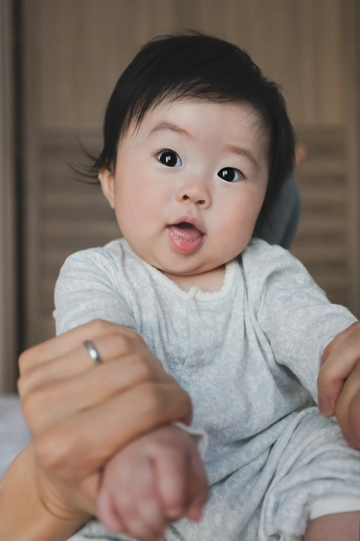 New parents with their baby during newborn photography session in Singapore