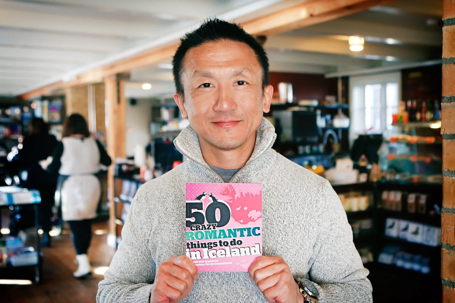 Desiree and Derek framed by Reykjavik architecture and soft Iceland light