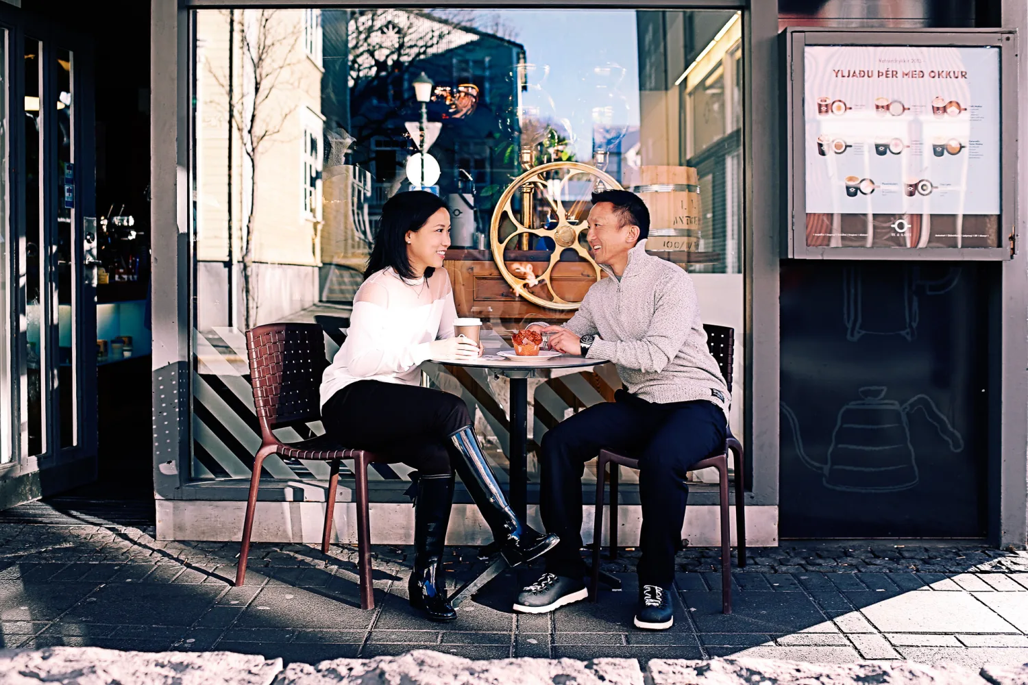 Desiree and Derek having coffee outside a Reykjavik cafe