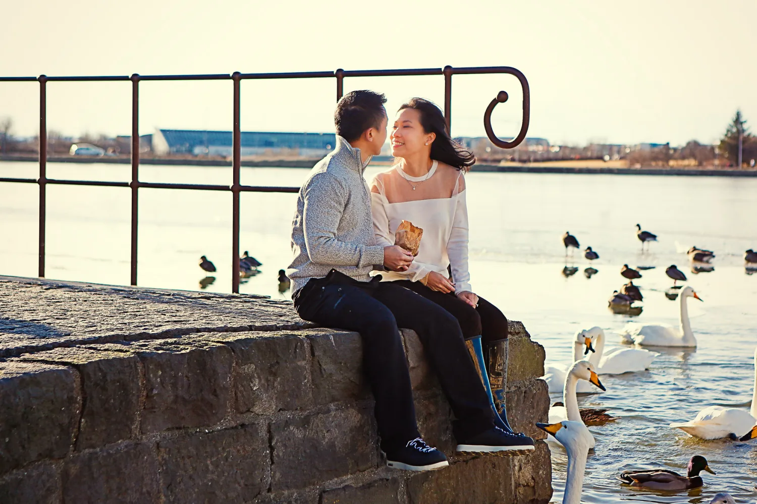 Desiree and Derek kissing with Reykjavik behind them