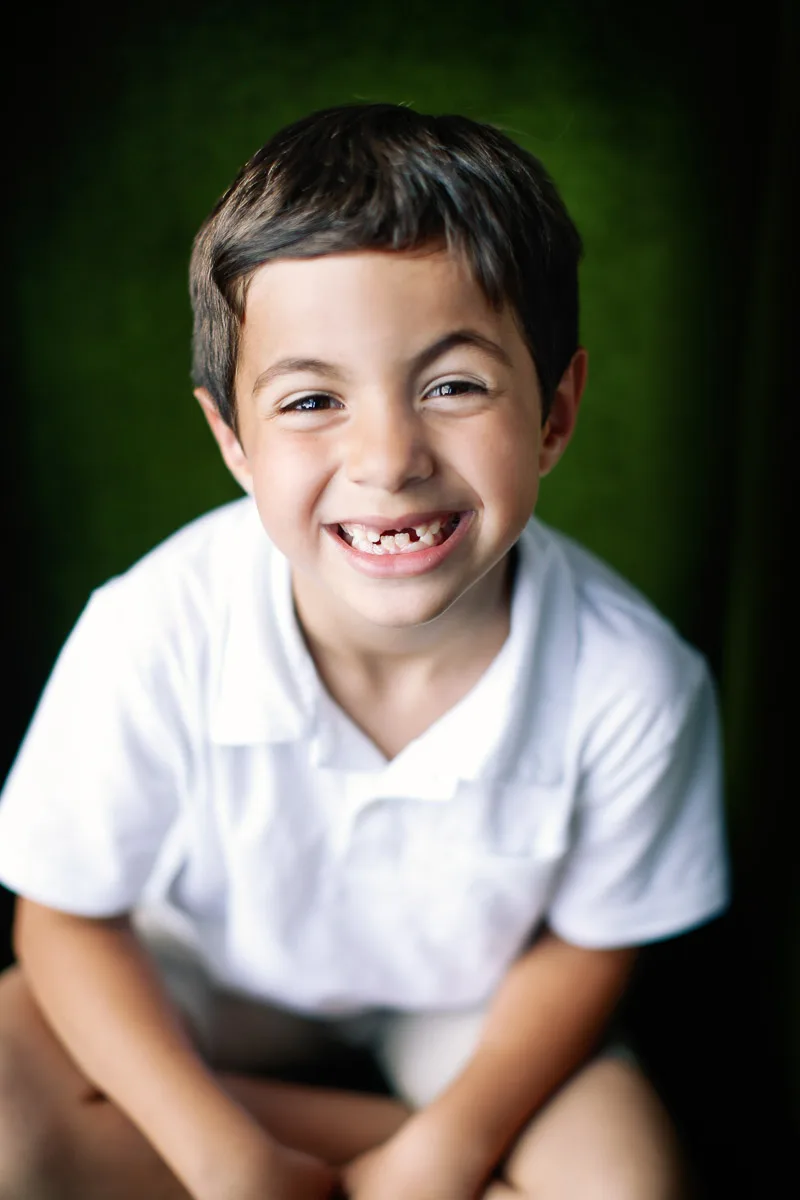 Jess smiling during an individual portrait at home in Singapore