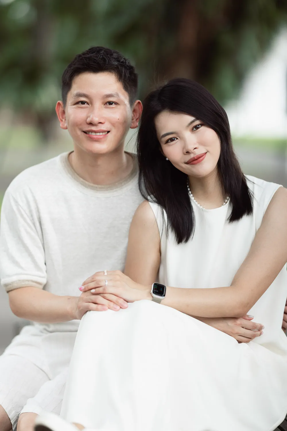 Wide shot of the family framed against the full Marina Bay panorama at dawn