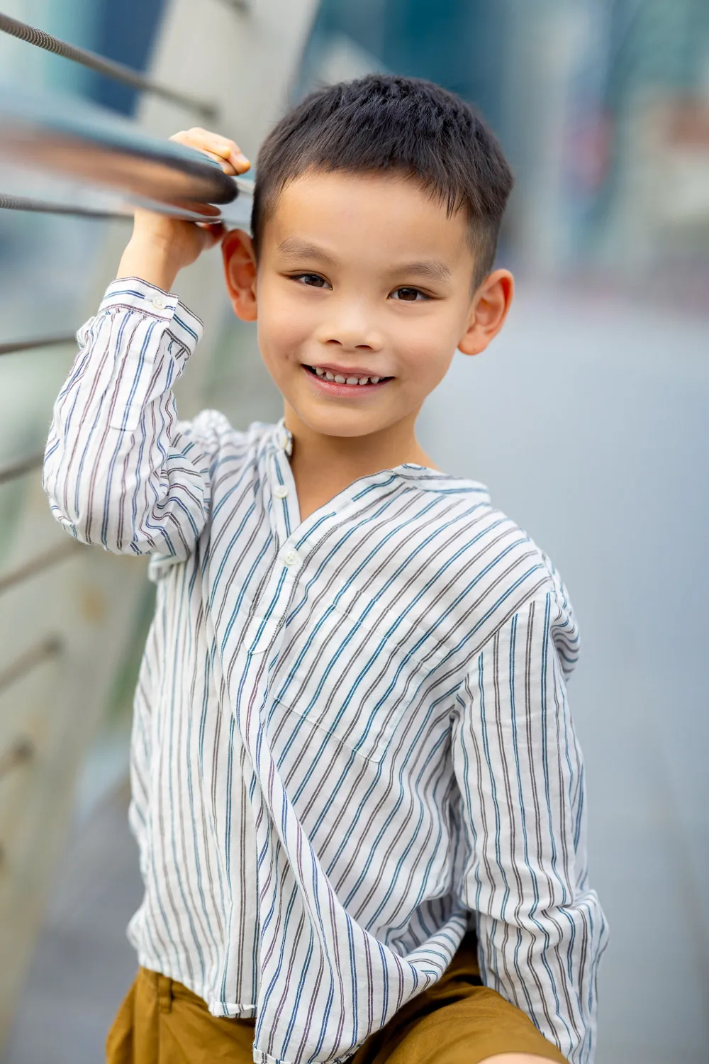 Parents and sons sharing a tender moment against the Singapore skyline