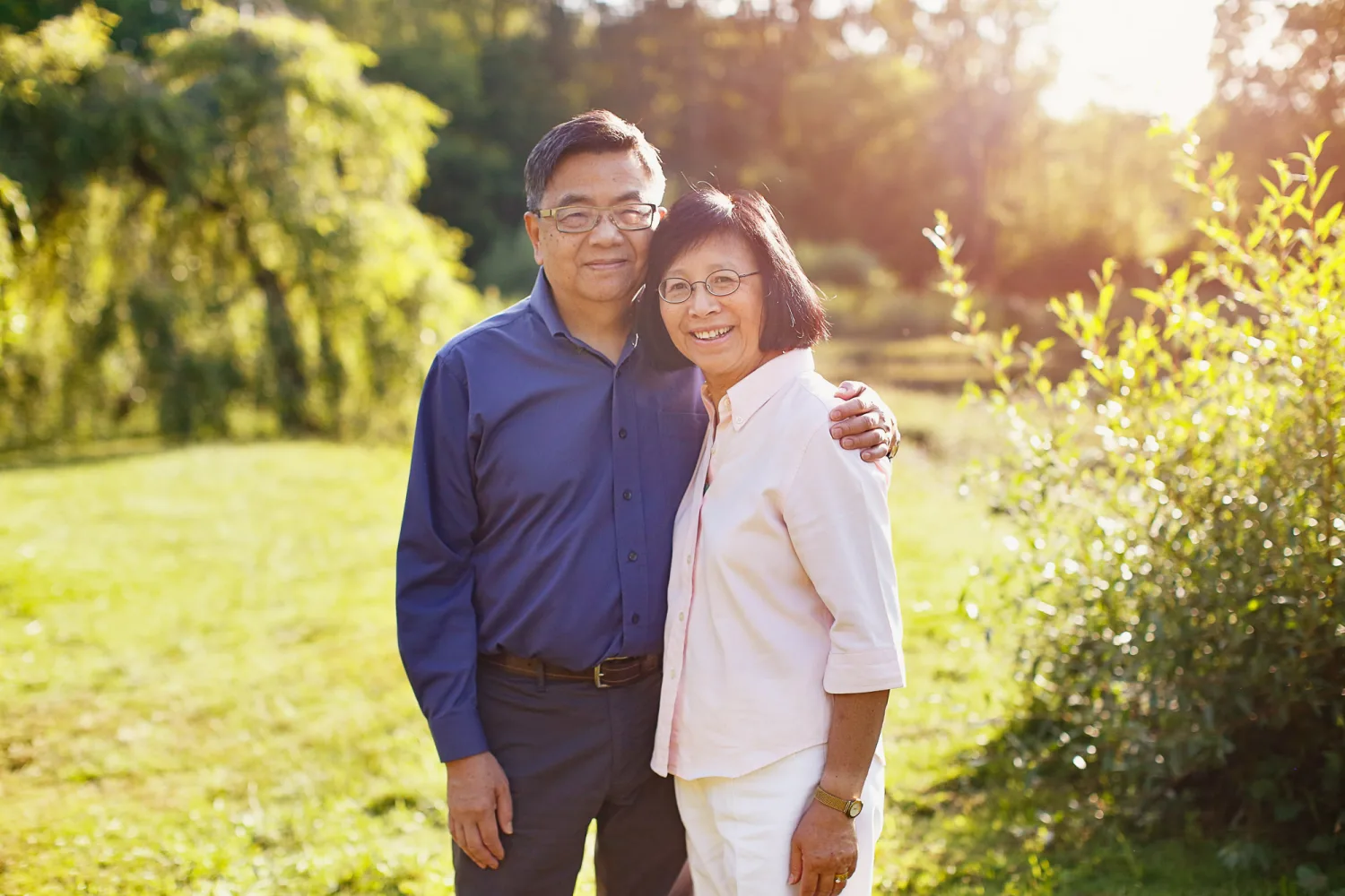 Jen and Evan with their daughters in the soft beach light