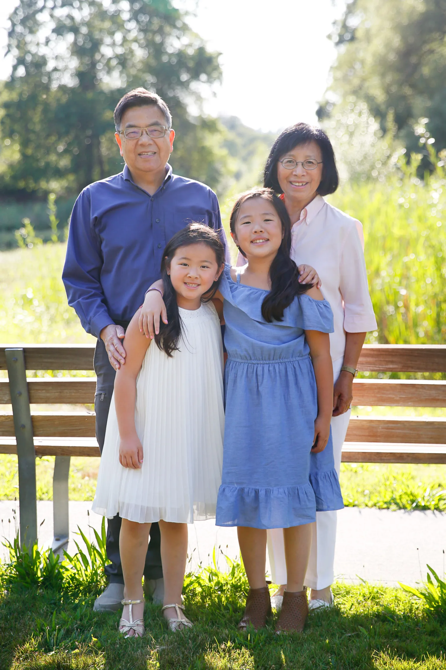 Jen and one of her daughters by the sand during a beach photoshoot in Vancouver