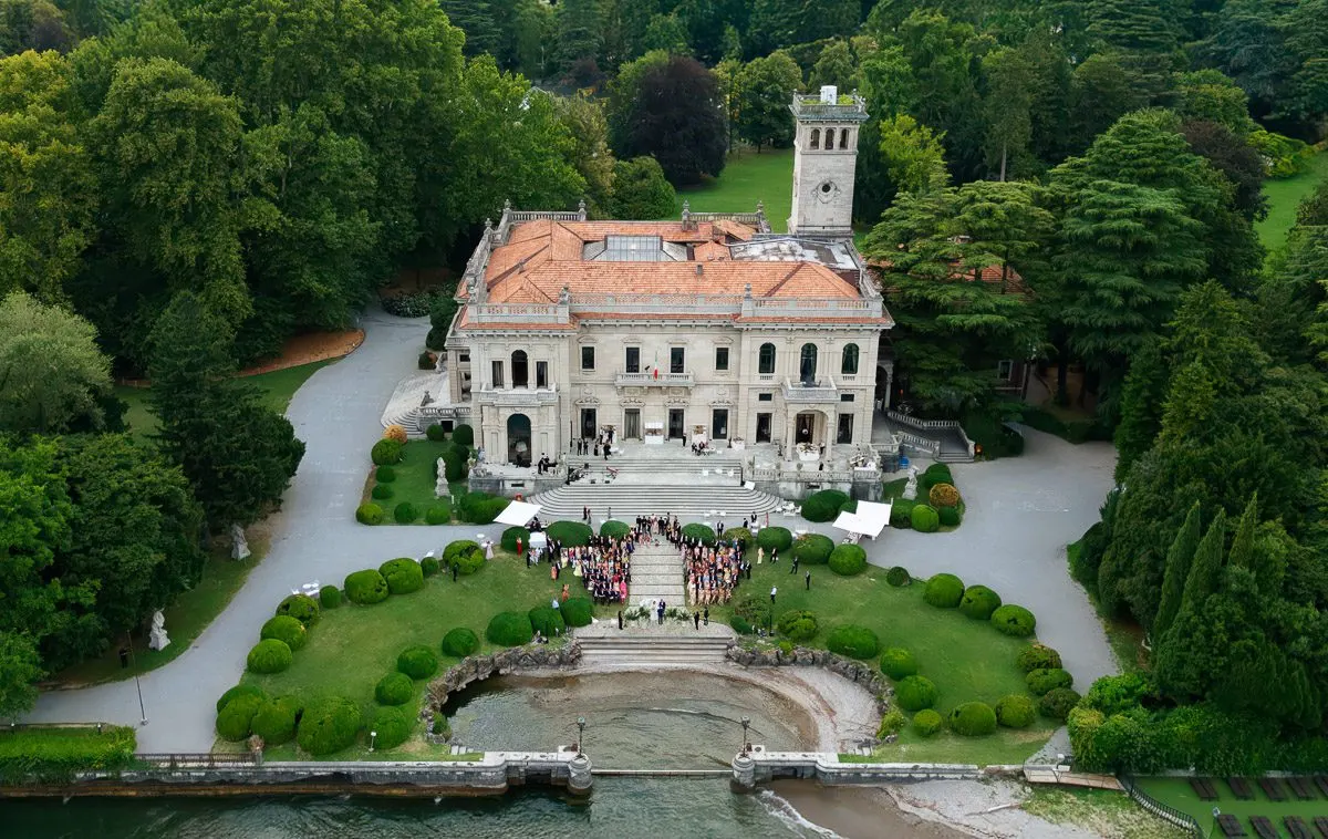 An aerial view of Villa Erba and its manicured grounds on the shores of Lake Como