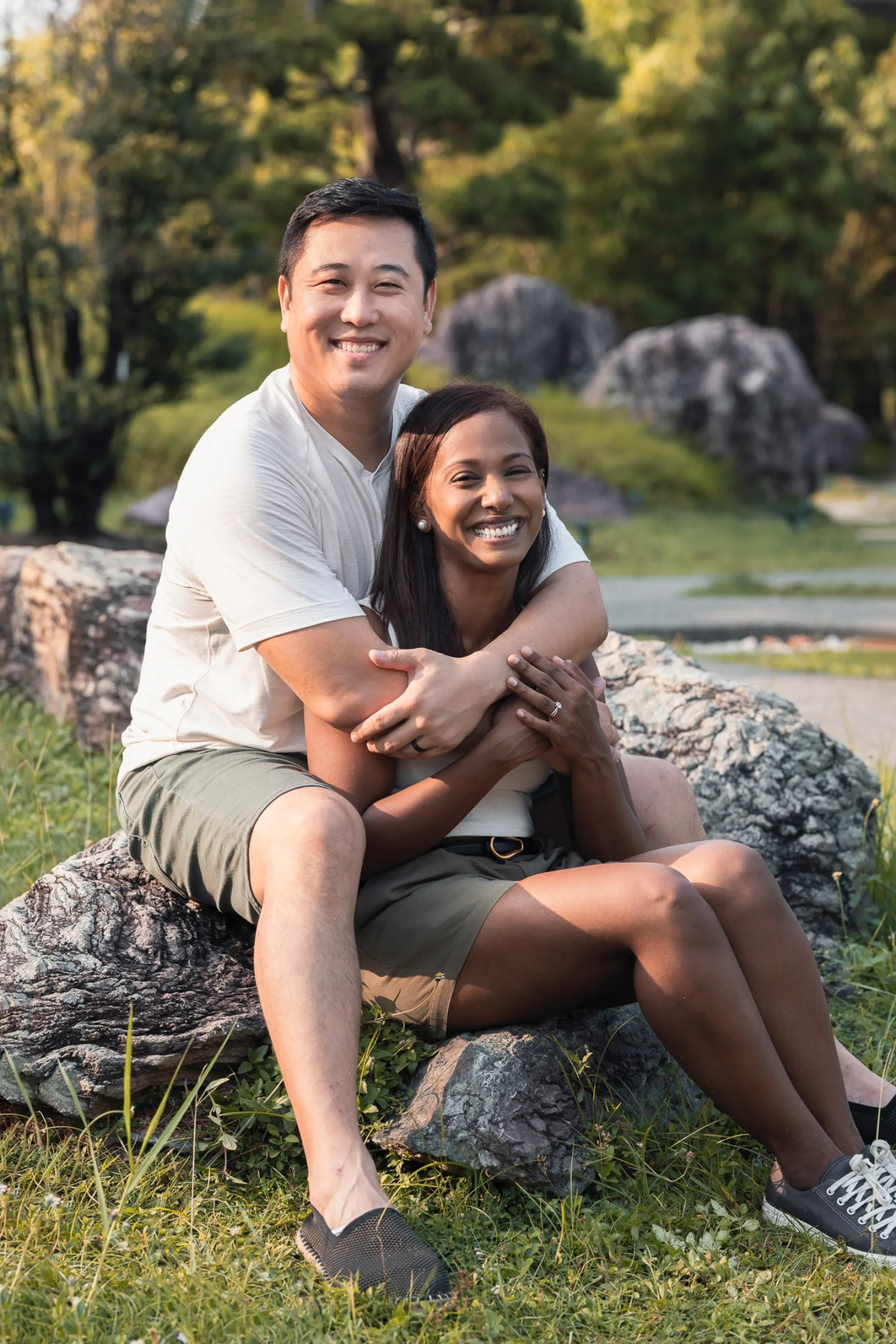 Dan and Jessica in a loving embrace on the rocks